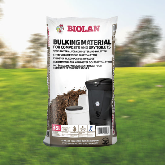Bag of BIOLAN bulking material for composts and dry toilets with a blurred green outdoor background