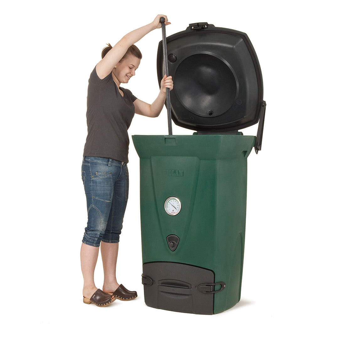 Person interacting with a green compost bin on a white background