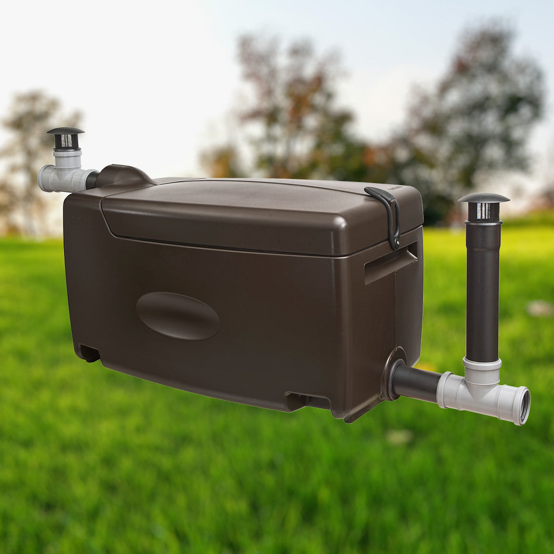 Brown rectangular water filter box with pipes on a grassy background